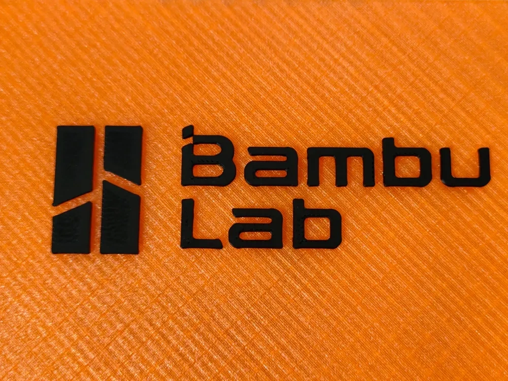 拓竹LOGO,1mm厚度 ,带定位框(整体尺寸:宽10cm*高3cm) - 免费 3D 打印模型 - MakerWorld