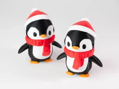 可爱的带围巾和小毛帽的企鹅